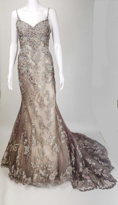 Elegant mermaid wedding dress with silver floral lace overlay and sheer train, perfect for custom bridal design.
