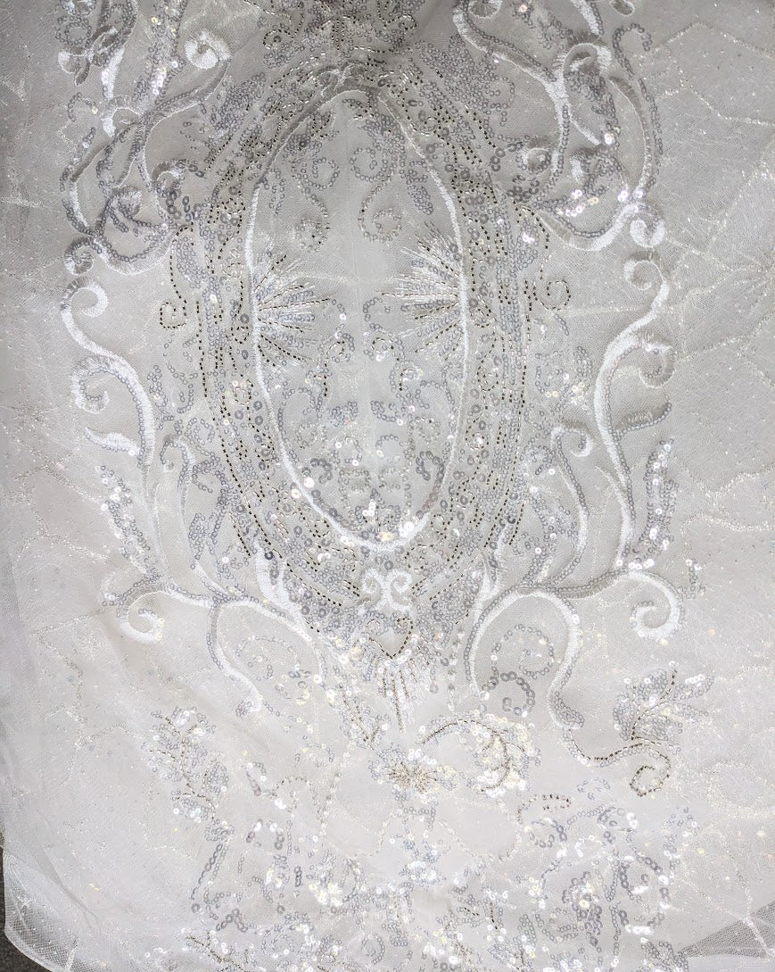 Sparkling silver sequin embroidery on sheer bridal fabric, intricate lace detailing for custom wedding dress