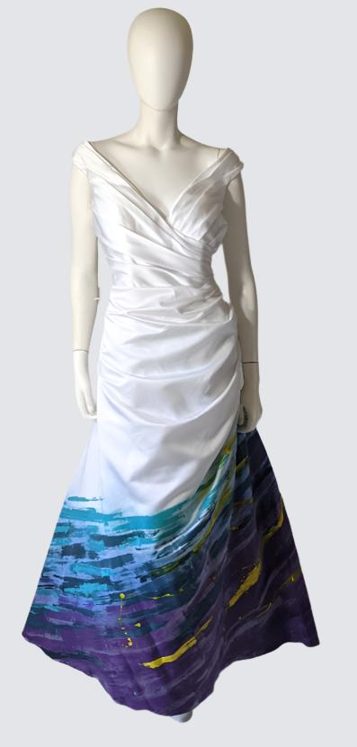 Custom wedding dress with ombre dye effect, blending white to purple and blue hues for unique bridal style.