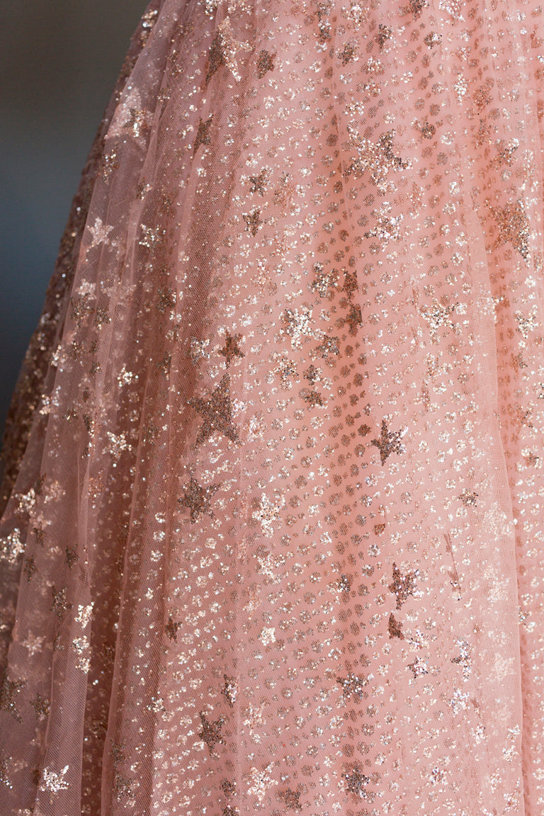 Pink tulle wedding dress with glitter stars, custom bridal design for celebrations