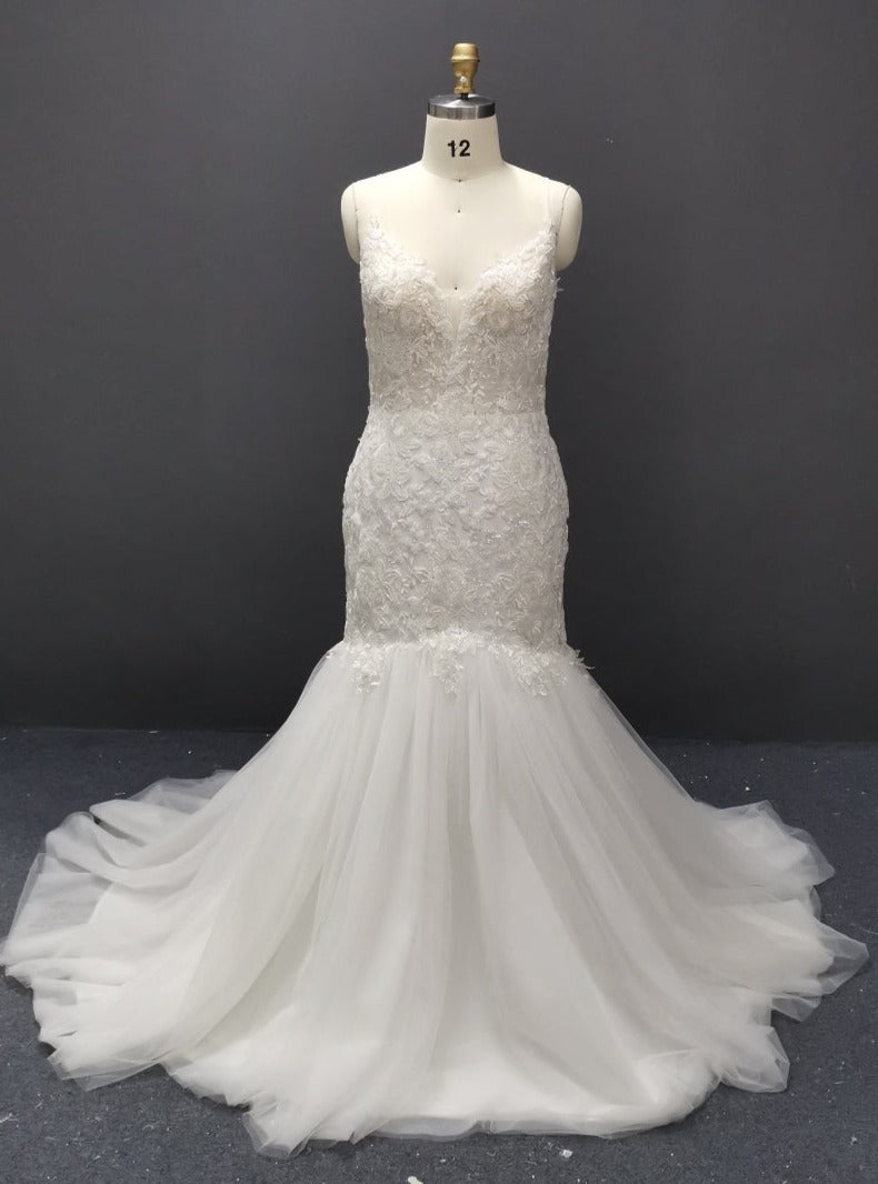 Elegant lace mermaid wedding dress with tulle skirt on mannequin