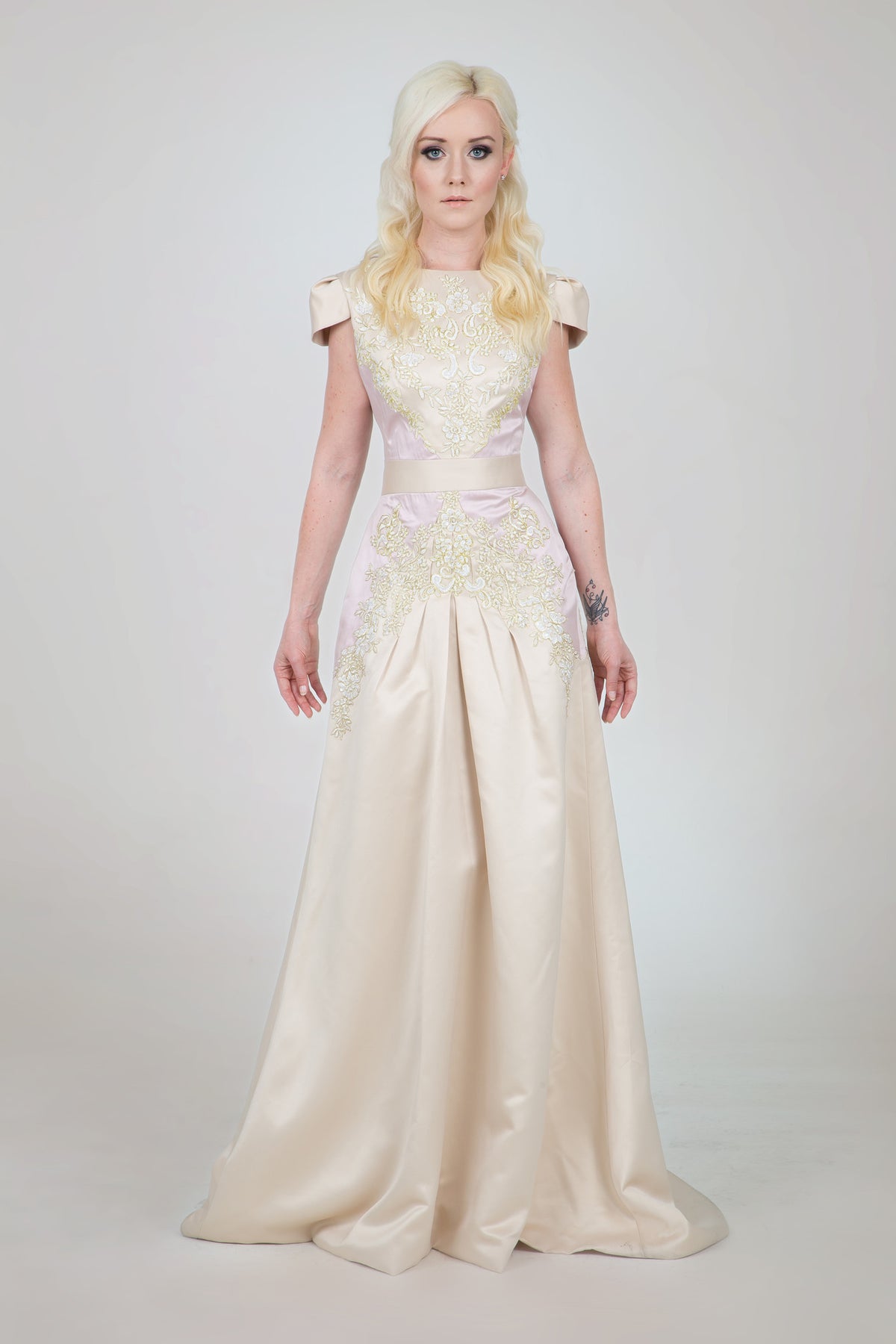 Elegant cream wedding dress with floral embroidery and cap sleeves for custom bridal style
