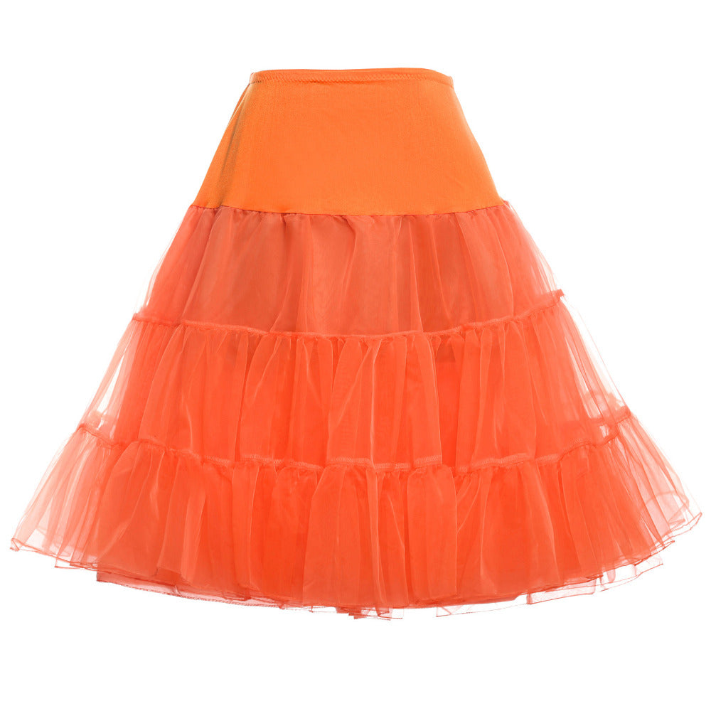 Vibrant orange tulle petticoat with tiered ruffles for wedding dress volume and playful bridal style