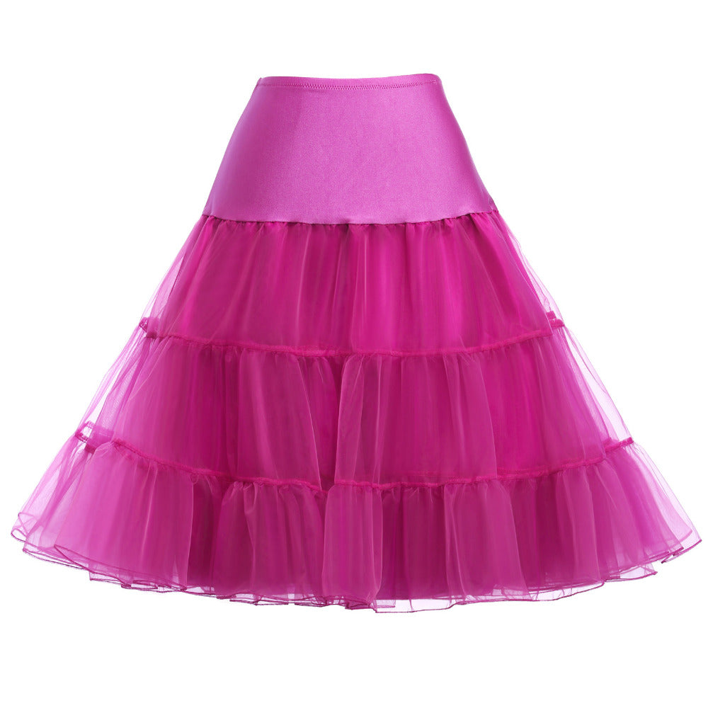 Vibrant pink tiered tulle skirt for custom bridal or celebration wear, featuring layered ruffles and a satin waistband.