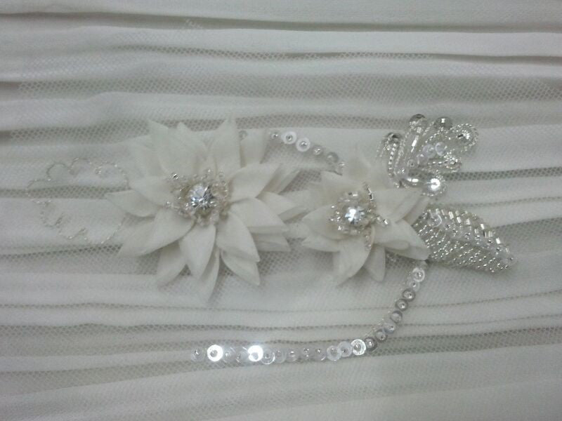 Elegant white floral bridal belt with rhinestones and sequins on sheer fabric