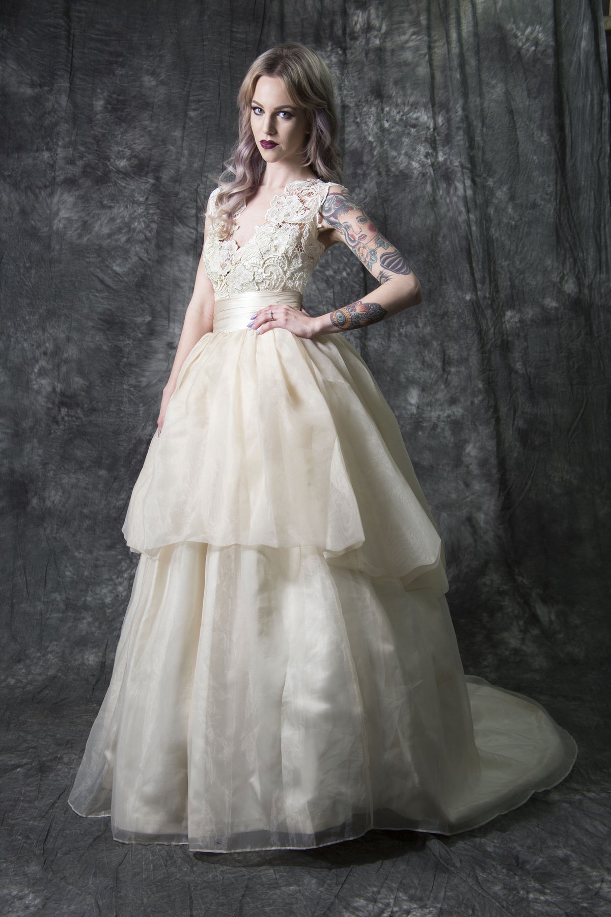Elegant lace wedding dress with tiered tulle skirt, perfect for custom bridal designs