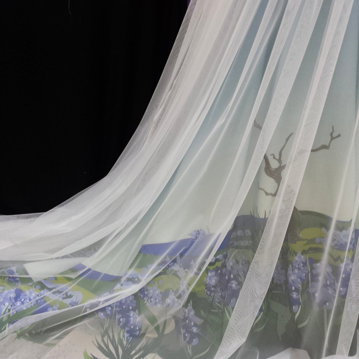 Sheer bridal veil with painted lavender fields and tree branches, flowing against black background