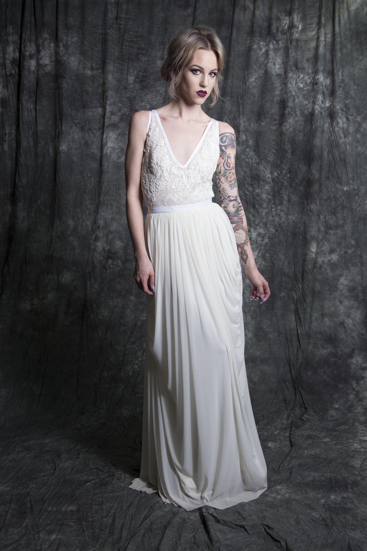 Boho lace wedding dress with flowing skirt, perfect for alternative brides seeking unique bridal style