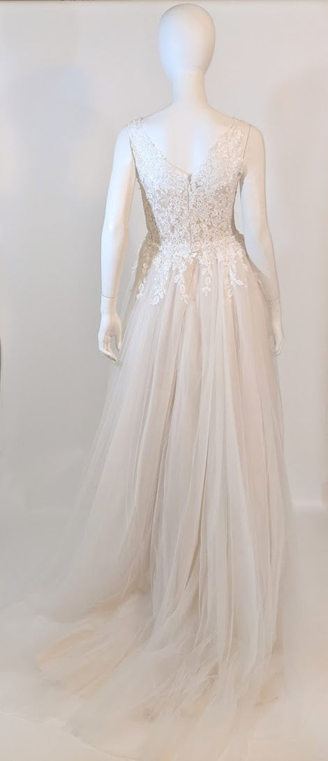 Elegant lace wedding dress with tulle skirt, custom bridal design for celebrations