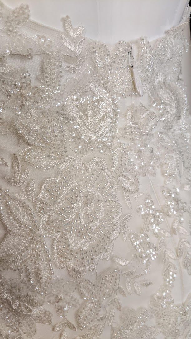 Luxury wedding dress with intricate floral beading and sequin embroidery, custom bridal design