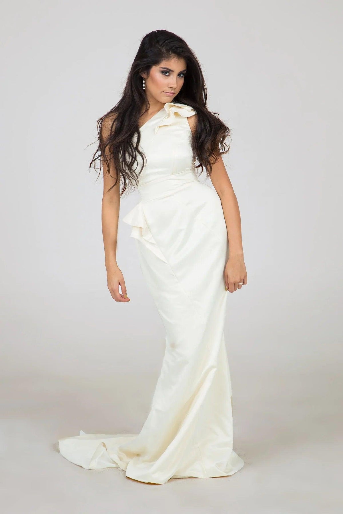 Elegant off-shoulder satin wedding dress with ruffled detailing and a flowing train