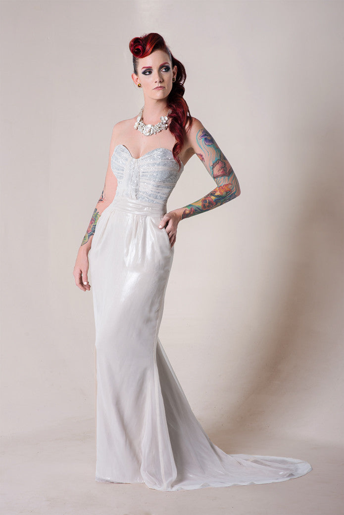 Custom white wedding dress with lace bodice, tattoos, and red hair for alternative bridal style
