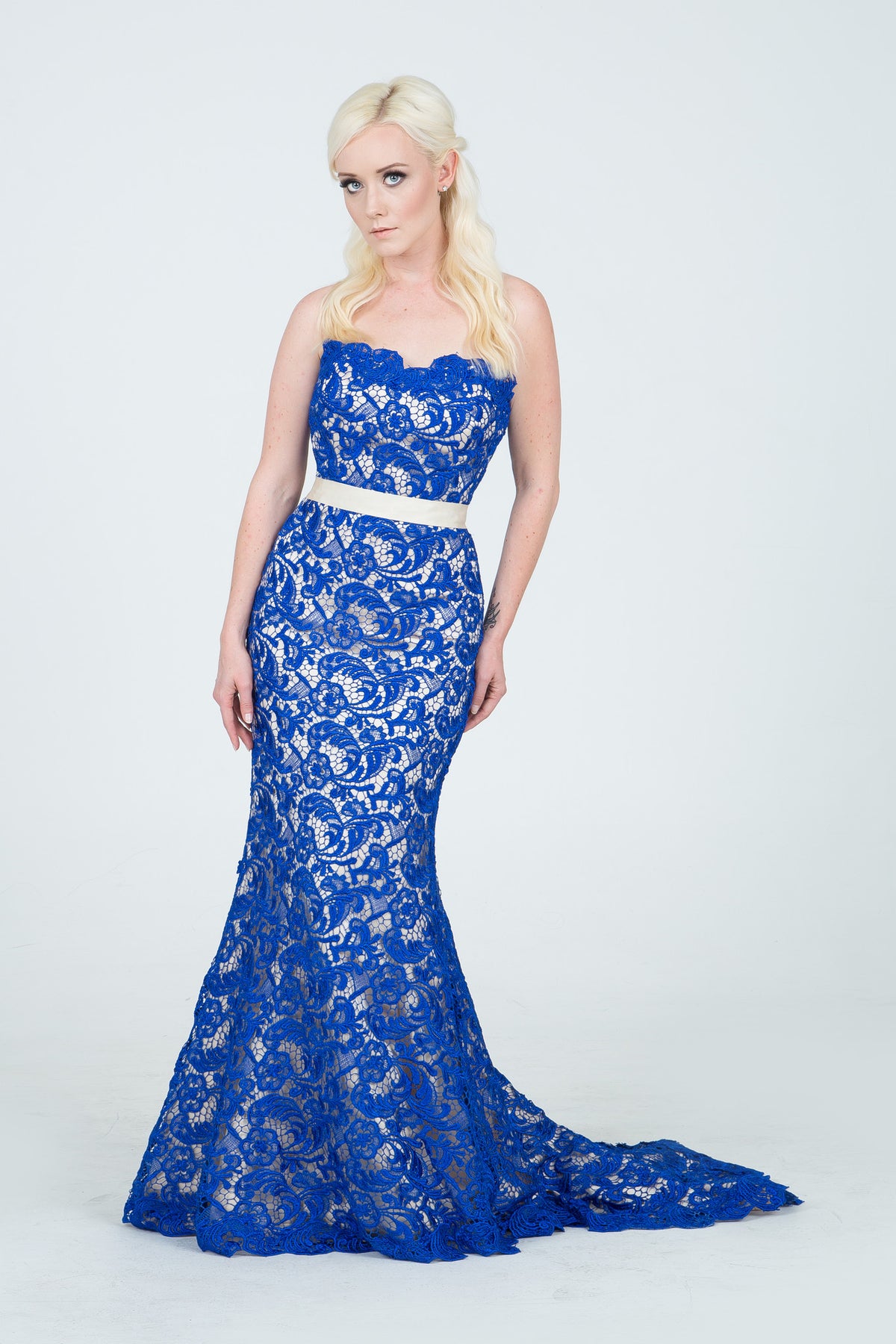 Royal blue lace mermaid wedding dress with white sash, custom bridal design