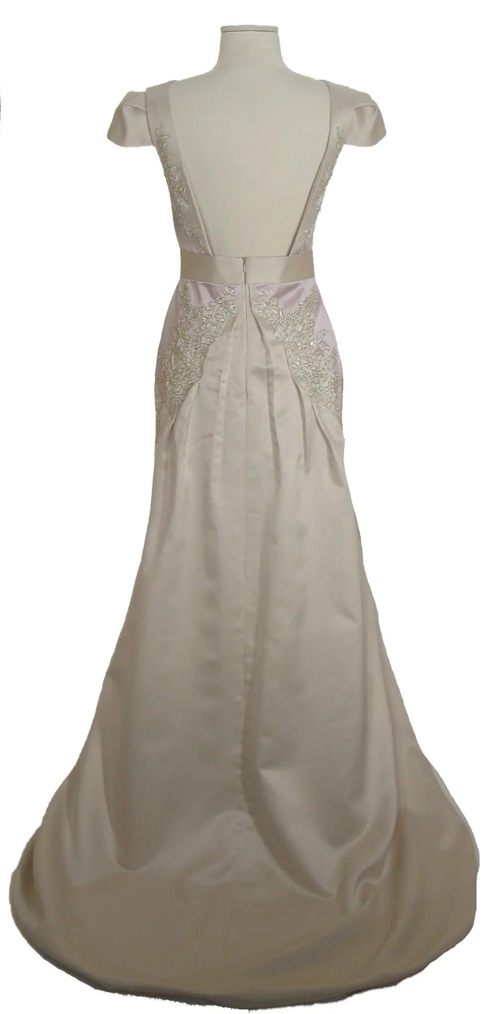 Elegant off-white wedding dress with lace detailing and cap sleeves, perfect for custom bridal designs.