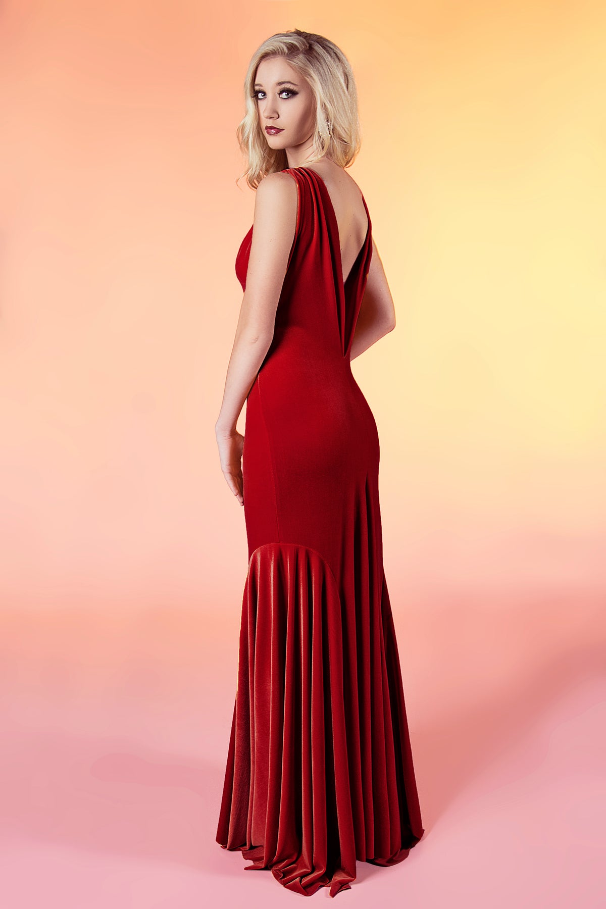 Red velvet wedding dress with open back and pleated skirt, custom bridal gown for unique celebrations